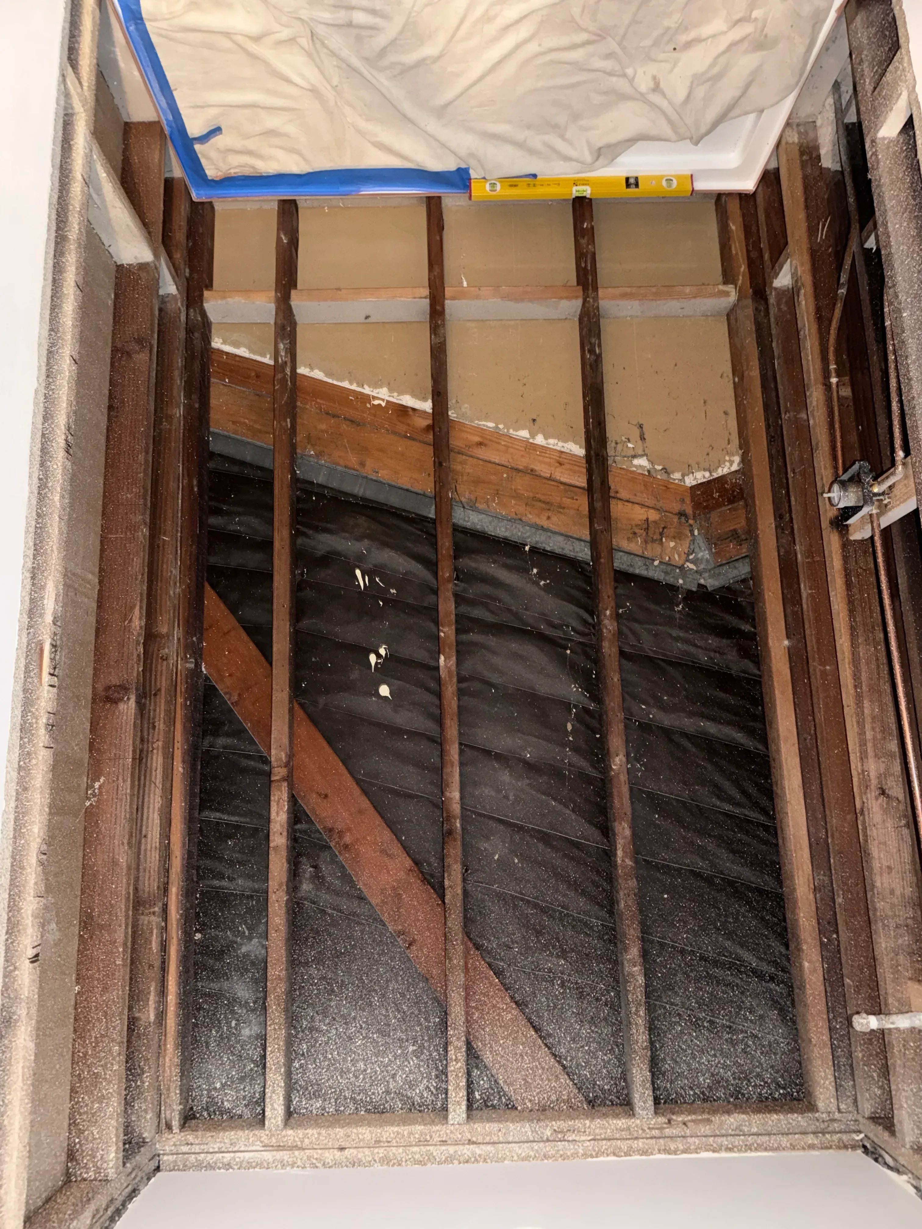 Roof framing with installed clay and concrete tiles secured by wooden battens during construction